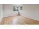 Bright bedroom features hardwood floors, recessed lighting, and ample natural light at 14186 E Hampden Pl, Aurora, CO 80014