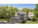 Beautiful two-story home with stone accents, a three-car garage, and a manicured lawn at 14186 E Hampden Pl, Aurora, CO 80014