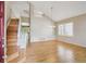 Bright living room with soaring ceilings, hardwood floors, and a staircase at 14186 E Hampden Pl, Aurora, CO 80014