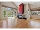 Bright living room with vaulted ceilings, fireplace, large windows and hardwood floors at 14186 E Hampden Pl, Aurora, CO 80014