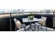 Balcony with a table and chairs, ideal for enjoying city views at 2880 Zuni St # 408, Denver, CO 80211