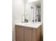 Bathroom featuring a modern vanity with a sink, mirror, and contemporary fixtures at 2880 Zuni St # 408, Denver, CO 80211