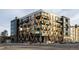 Modern apartment building featuring a unique architectural design and visible balconies at 2880 Zuni St # 408, Denver, CO 80211