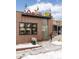 Commercial building with a brick facade and colorful 'Root Down' signage, evoking a modern and inviting atmosphere at 2880 Zuni St # 408, Denver, CO 80211