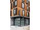 Modern building corner featuring unique metal panels, contrasting black trim, and the understated 'Sonder' sign at 2880 Zuni St # 408, Denver, CO 80211