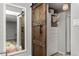 Bedroom with barn door and mirrored closet at 100 S Clarkson St # 105, Denver, CO 80209