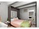 Comfortable bedroom with murphy bed, complemented by a modern decor and wood-look flooring at 100 S Clarkson St # 105, Denver, CO 80209