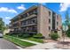 Attractive multi-unit building with landscaping and street parking at 100 S Clarkson St # 105, Denver, CO 80209