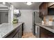 Granite countertops and stainless steel appliances feature in this galley kitchen at 100 S Clarkson St # 105, Denver, CO 80209