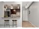 Charming kitchen with breakfast bar, stylish pendant lighting, and modern appliances at 100 S Clarkson St # 105, Denver, CO 80209