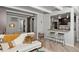 Cozy living room featuring a modern sofa, barn door accent, and stylish breakfast bar at 100 S Clarkson St # 105, Denver, CO 80209