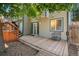 Spacious wooden deck features stairs and walkway for easy access to the backyard at 3647 S Uravan St, Aurora, CO 80013