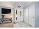 Welcoming foyer with marble flooring, closet and front door with decorative glass at 3647 S Uravan St, Aurora, CO 80013