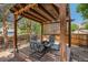 Outdoor gazebo with string lights, wooden beams, and comfortable seating for relaxing at 3647 S Uravan St, Aurora, CO 80013