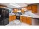 Charming kitchen features modern appliances, ample cabinetry, granite countertops, and tile backsplash at 3647 S Uravan St, Aurora, CO 80013