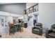 Open-concept living area flows to kitchen with breakfast bar, and features an open staircase to the upper floor at 3647 S Uravan St, Aurora, CO 80013