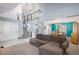 Open concept living space showcasing the staircase, dining area, and a spacious living room at 3647 S Uravan St, Aurora, CO 80013