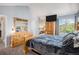 Spacious primary bedroom featuring natural wood furniture, neutral walls, and great natural light at 3647 S Uravan St, Aurora, CO 80013
