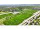 Aerial view of a soccer field and a tranquil pond at 6088 Quail Ct, Arvada, CO 80004