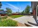 Expansive backyard with a concrete patio, grassy area, shed, and mature landscaping at 6088 Quail Ct, Arvada, CO 80004
