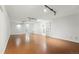 Finished basement featuring a large open layout and sleek track lighting at 6088 Quail Ct, Arvada, CO 80004