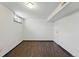 Bright and airy basement with wood-look floors, fresh paint, and a window for natural light at 6088 Quail Ct, Arvada, CO 80004