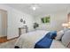 Comfortable bedroom showcasing a plush bed, hardwood floors, soft lighting, and serene atmosphere at 6088 Quail Ct, Arvada, CO 80004