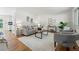 Elegant living room with hardwood floors, neutral tones, and plenty of natural light at 6088 Quail Ct, Arvada, CO 80004