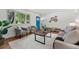 Cozy living room featuring hardwood floors, neutral decor, and bright natural light at 6088 Quail Ct, Arvada, CO 80004