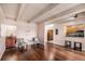 Well-lit living room featuring hardwood floors, comfortable seating, and a kitchen view at 7865 E Mississippi Ave # 1102, Denver, CO 80247