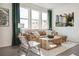 Sunlit living room with leather sectional sofa and large windows at 22375 E 6Th Ave, Aurora, CO 80018