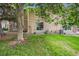 A view of the backyard with grass, foliage, and sliding glass doors at 1534 S Ouray Cir # B, Aurora, CO 80017