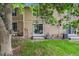 A view of the backyard with grass, foliage, and sliding glass doors at 1534 S Ouray Cir # B, Aurora, CO 80017