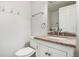 Bathroom with granite countertop vanity, mirror, and white fixtures at 1534 S Ouray Cir # B, Aurora, CO 80017