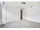 Neutral bedroom features a large closet and overhead lighting at 1534 S Ouray Cir # B, Aurora, CO 80017
