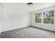 Bright bedroom with carpet flooring and double windows, offering natural light at 1534 S Ouray Cir # B, Aurora, CO 80017