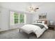 Comfortable bedroom showcasing a ceiling fan, natural light from windows, and a serene atmosphere at 1534 S Ouray Cir # B, Aurora, CO 80017