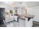 Modern kitchen featuring granite countertops, white cabinets, and stainless steel appliances at 1534 S Ouray Cir # B, Aurora, CO 80017