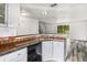 Kitchen featuring granite countertops, white cabinets, and stainless steel appliances at 1534 S Ouray Cir # B, Aurora, CO 80017