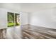 Inviting living room with wood floors and a sliding glass door showcasing the outdoors at 1534 S Ouray Cir # B, Aurora, CO 80017