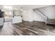 Open floor plan featuring sleek flooring, staircase, and plenty of natural light at 1534 S Ouray Cir # B, Aurora, CO 80017
