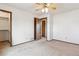 Bedroom with a ceiling fan and access to an attached bathroom at 10241 Routt St, Broomfield, CO 80021