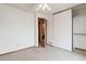 Bright bedroom features a ceiling fan, closet, and attached bathroom at 10241 Routt St, Broomfield, CO 80021