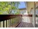 Balcony showcasing an outdoor space with wooden floors and railings and views of mature trees at 14590 E 2Nd Ave # B309, Aurora, CO 80011