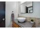 Bathroom featuring a modern sink and vanity with decorative mirror at 14590 E 2Nd Ave # B309, Aurora, CO 80011