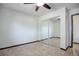 Bedroom showcasing a mirrored closet and neutral walls with tile flooring at 14590 E 2Nd Ave # B309, Aurora, CO 80011