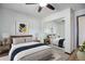 Comfortable bedroom with ceiling fan and mirrored closet doors at 14590 E 2Nd Ave # B309, Aurora, CO 80011