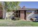 Multi-story condo building features private balconies and a well-maintained lawn and landscaping at 14590 E 2Nd Ave # B309, Aurora, CO 80011