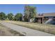 Condominium exterior with mature trees and a walking path located close to the building at 14590 E 2Nd Ave # B309, Aurora, CO 80011
