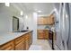 Modern kitchen featuring stainless steel appliances, ample cabinetry, and stone counter tops at 14590 E 2Nd Ave # B309, Aurora, CO 80011